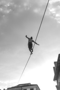 A person walking a tightrope