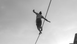 A person walking a tightrope