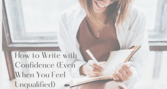 Smiling woman writing in a notebook while sitting by a window, symbolizing confidence in writing and encouragement for writers who feel unqualified.
