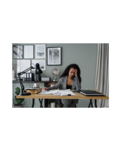 woman sitting at a desk working